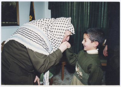 Yasser Arafat Kissing the Hand of Young Omar abu Hasna, Jericho, the 1990s