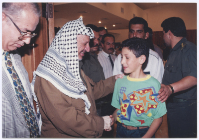 Yasser Arafat Shaking Young Omar abu Hasna