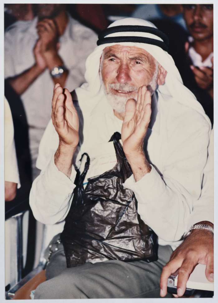 A Palestinian Man Clapping During Mawlid at Birzeit University, Birzeit, the 1990s