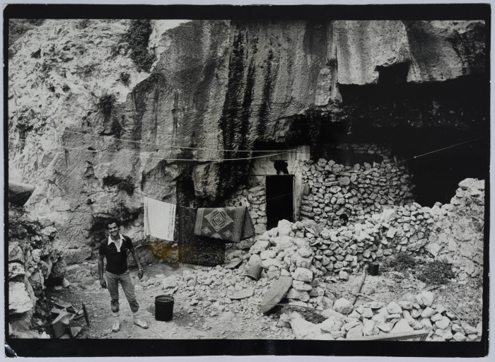 Two Palestinians Living in a House in a Rocky Area, the 1990s