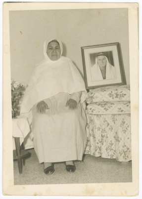 Khadija al-Shalabi Next to a Photograph of Her Husband, the Early 1960s