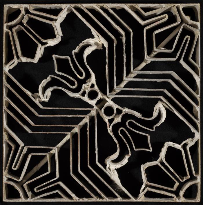 A Coloured Cement Tile and the Mold Used to Manufacture It,