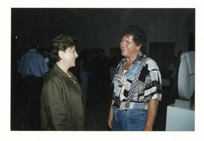 A photograph of artist Jabr Alwan, Mona Atassi from the opening of Arab Professionals exhibition, Beirut, 2001
