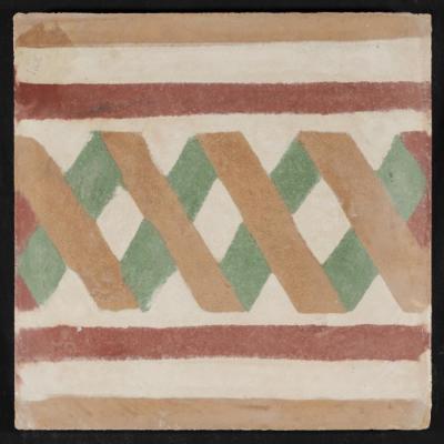 بلاطة إسمنتية ملونة والقالب المستخدم لصناعتها 