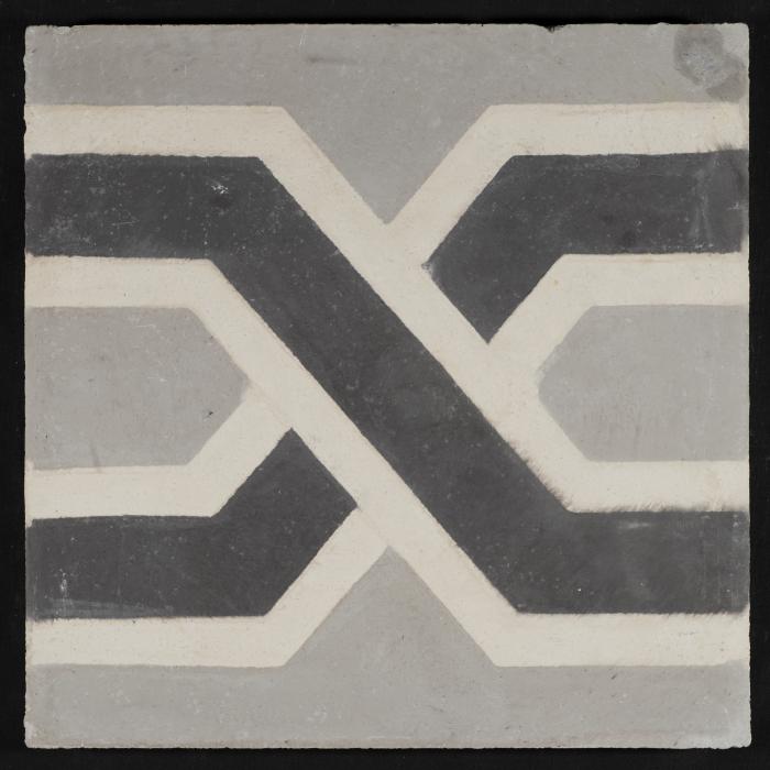 بلاطة إسمنتية ملونة والقالب المستخدم لصناعتها 