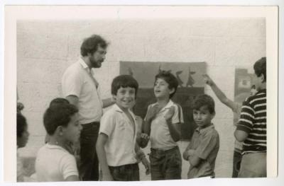 Sliman Mansour with a number of children, Deir Ghassaneh, 1984