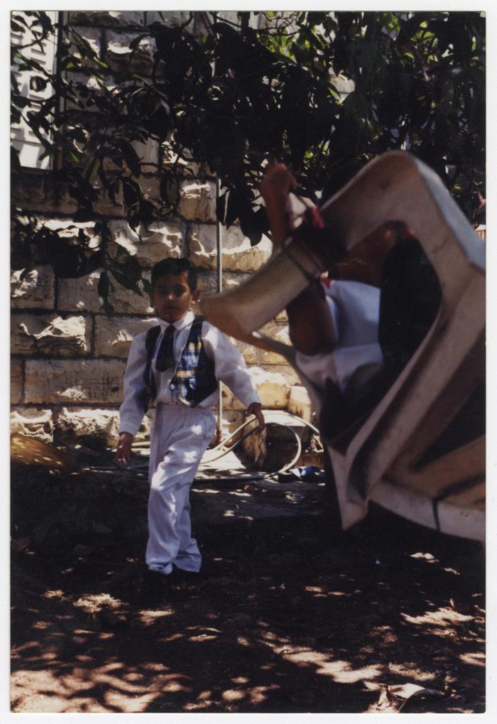 Oday Tayseer Barakat in the Garden of their house, Al-Bireh, 1990s
