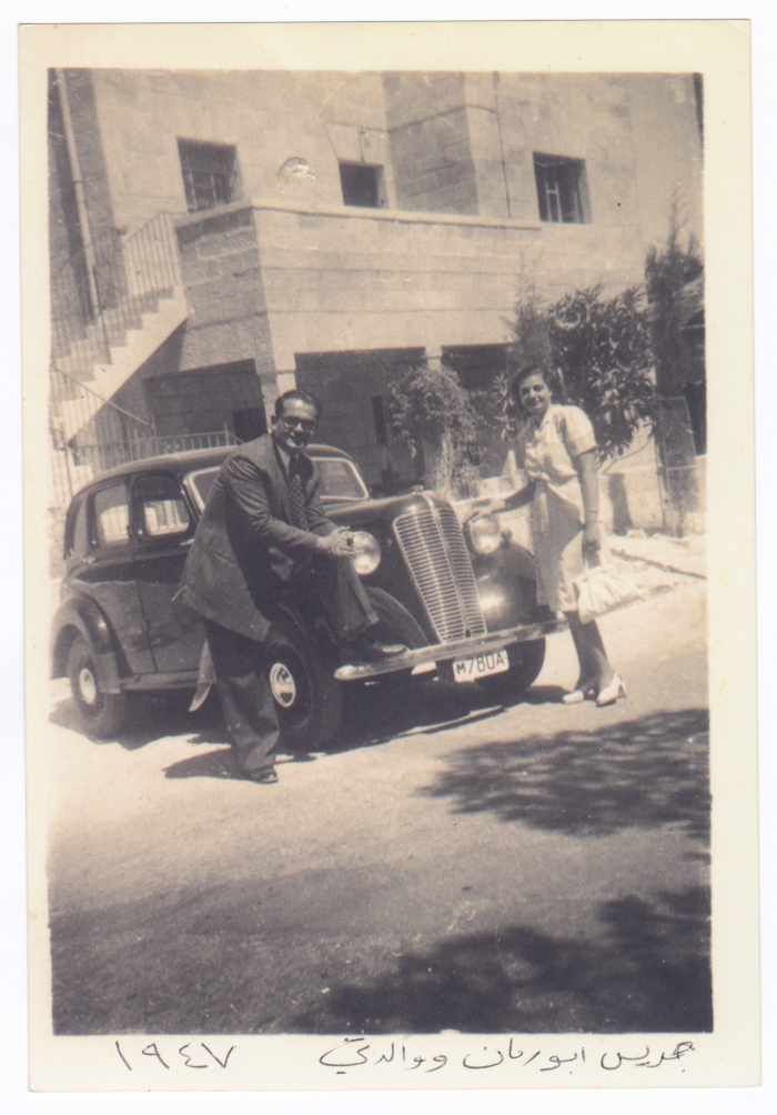 Jeries Abu Rummaneh and his wife before the Everest Hotel in Beit jala