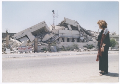 Maha El-Saca standing before the demolished Police Station in Bethlehem
