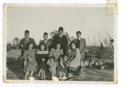 A Photograph of Jeryes Abu Rumman with Friends at His House Yard in Gaza, 1952
