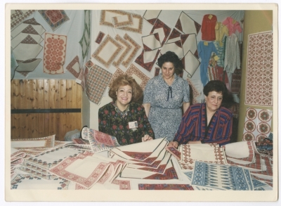 Maha El-Saca with two ladies in an Embroidery Exhibition