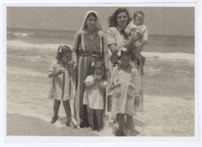 Ellen Abu Rumman and Her Children with the Housekeeper on the Gaza Beach, 1953