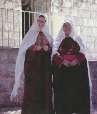 Miladah Abu Rummaneh, and another woman wearing the Bethlehem bride traditional dress "Al-Malak"