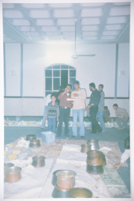 A Photograph of a Group of Men Preparing Food at a Wedding Ceremony in Sa