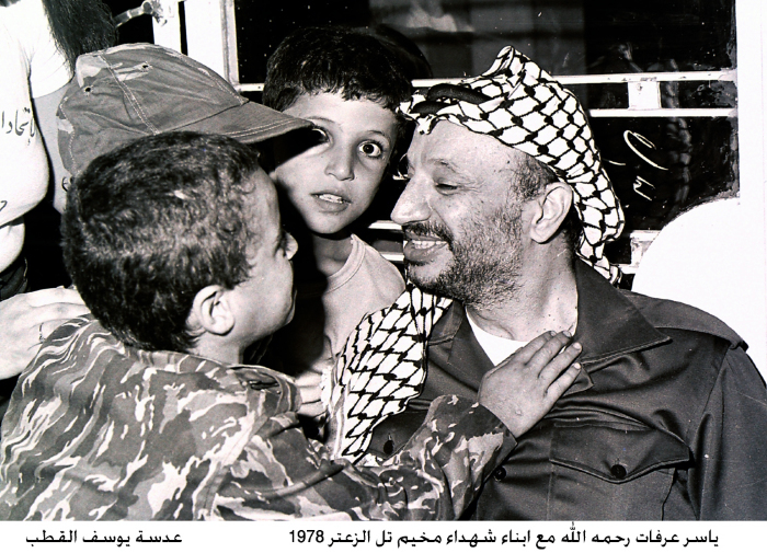 Yaser ʿarafat with shaheeds' children in Tel Zaatar camp in 1978