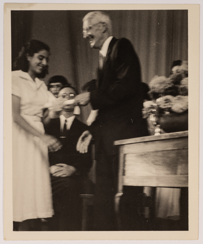A Student from the Friends School Receives Her Certificate