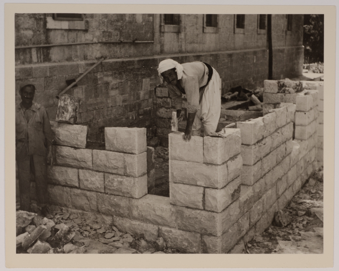 Two Men Building a Wall
