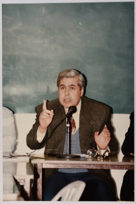 A Man Speaking at a Meeting