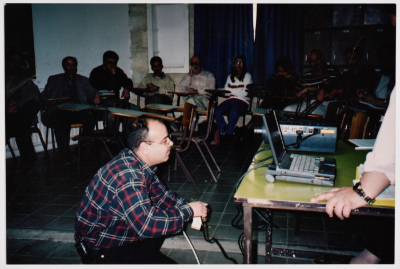 A Man Facing a Computer 