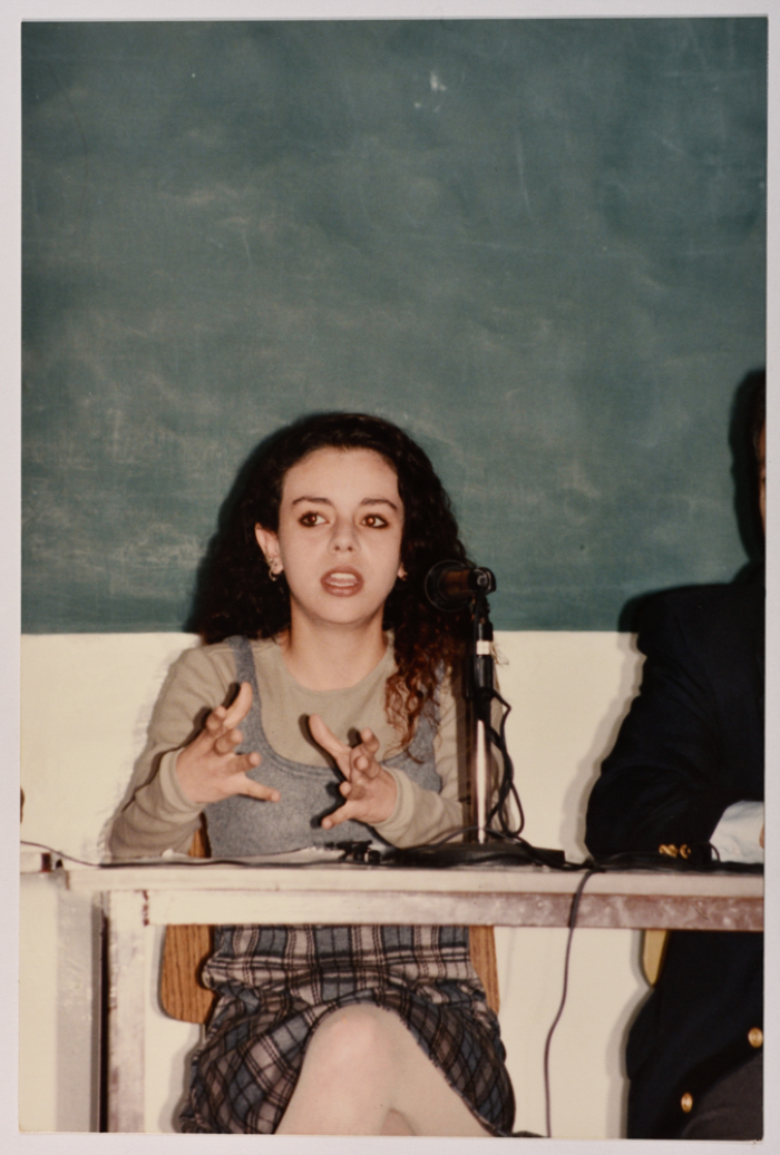 A Woman Speaking in a Meeting