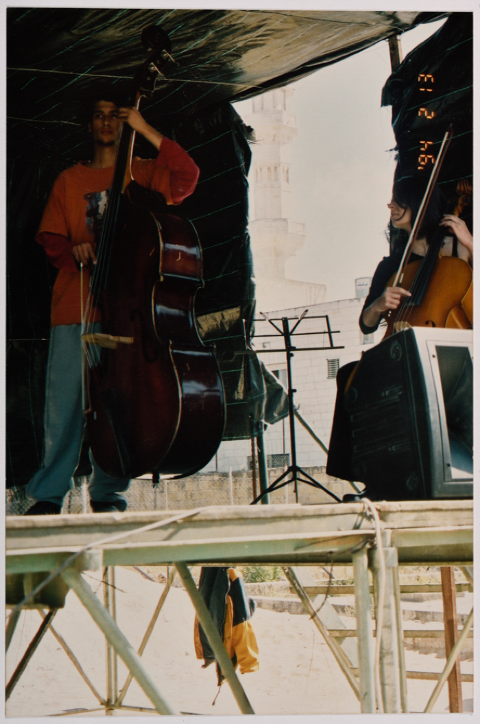 Two People Playing Musical Instruments