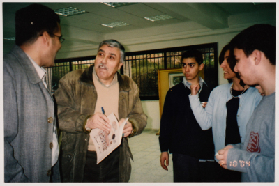 Two Students Accompanied by their Teachers and the Palestinian Artist Nabil Anani