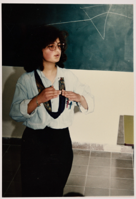 Teacher Explaining inside a Classroom 