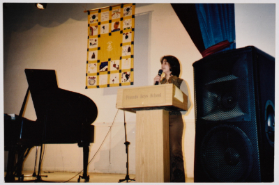 A Young Female Student Standing on the Stage