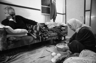 A Palestinian Woman Makes Bread During Curfew, al-Amari Camp, 1988