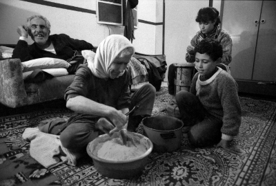 A Palestinian Woman Makes Bread During Curfew, al-Amari Camp, 1988