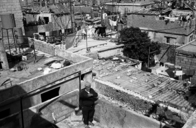A Man from the Abu Libdeh Family on the Roof of Their Home, Al-Amari Camp, 1988

