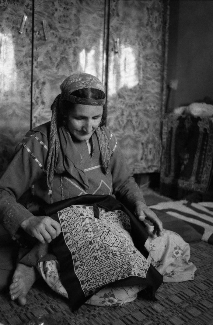Um ʿadnan Embroidering a Palestinian Thobe in al-Mazra'a ash-Sharqiyya Town, 1988