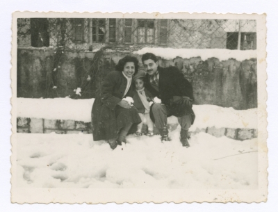 Emile Habibi in the snow with his wife and daughter