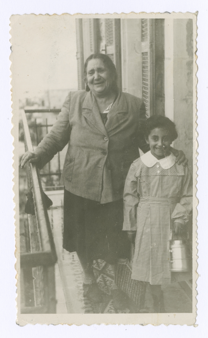 Emile Habibi's mother in Haifa with her granddaughter