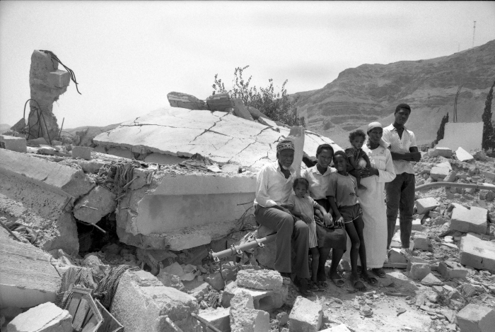 A Photograph of a Family in Front of Their Demolished House in Jericho, 1989