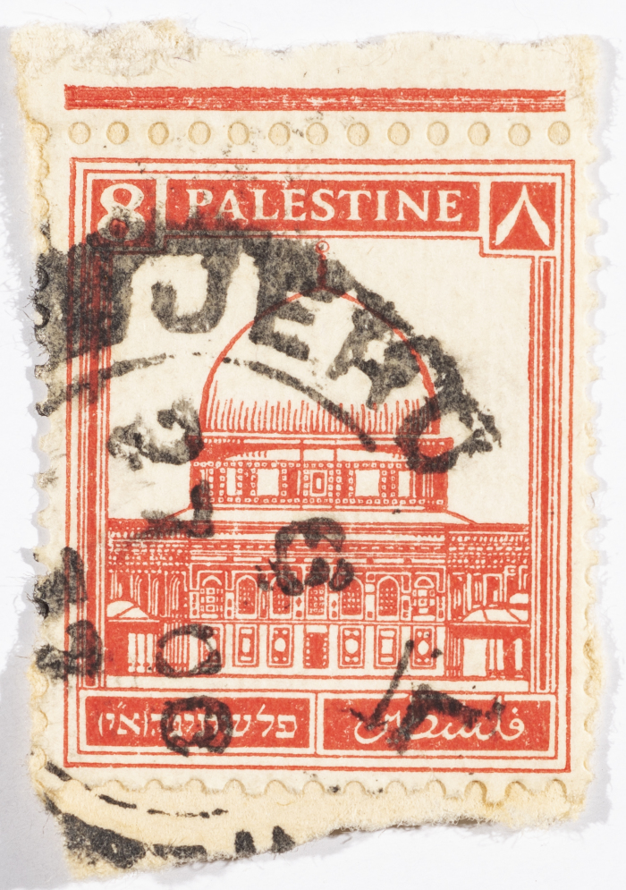 A postage stamp used in Palestine during the British Mandate
