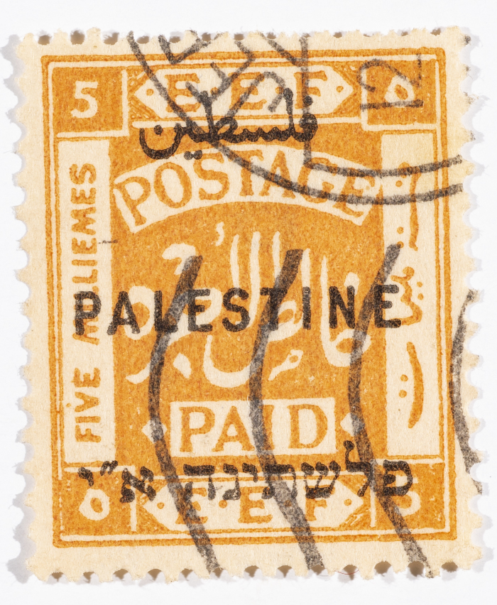 A postage stamp used in Palestine during the British Mandate