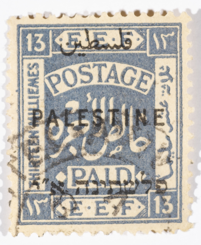 A postage stamp used in Palestine during the British Mandate