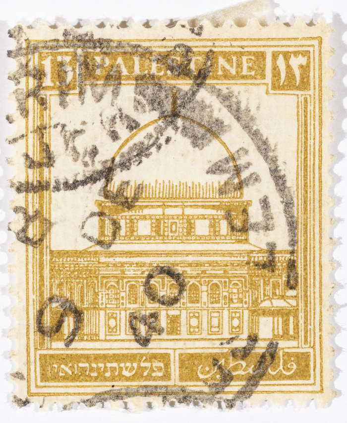 A postage stamp used in Palestine during the British Mandate