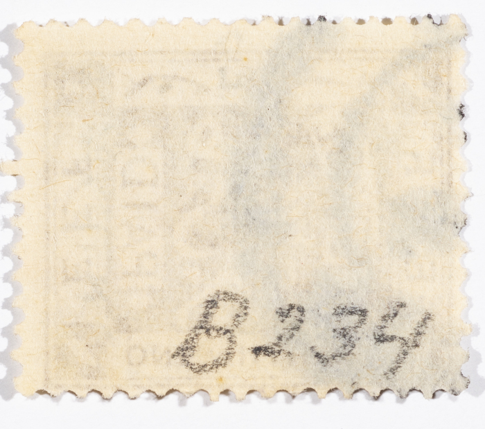 A postage stamp used in Palestine during the British Mandate
