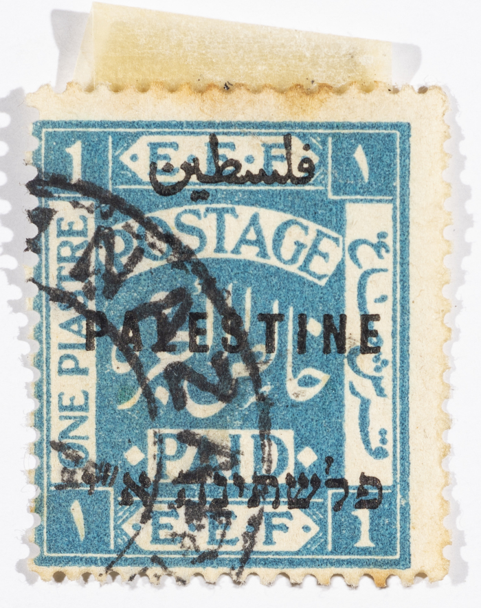 A postage stamp used in Palestine during the British Mandate