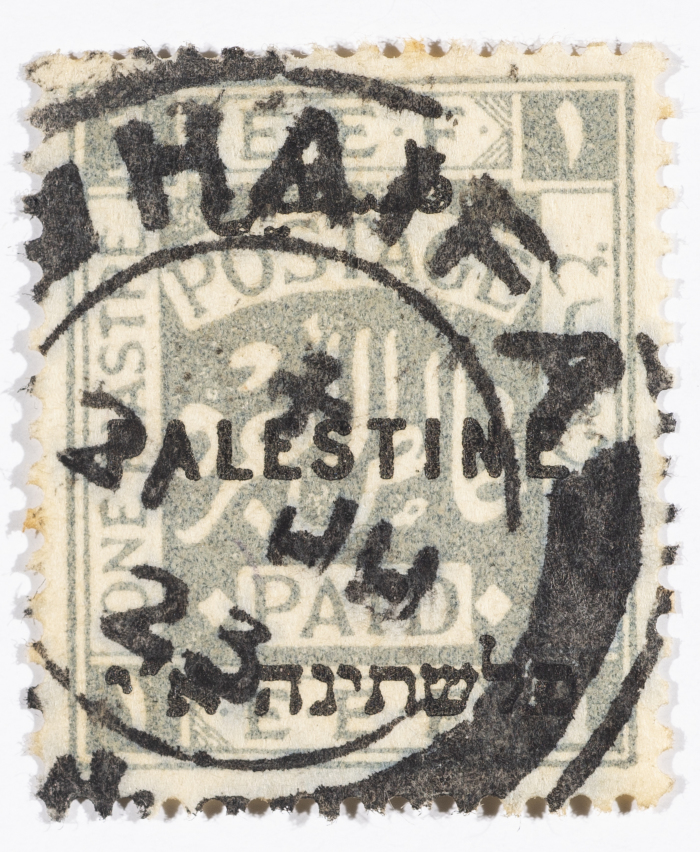 A postage stamp used in Palestine during the British Mandate
