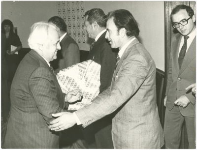 Two Communist Party men shaking hands