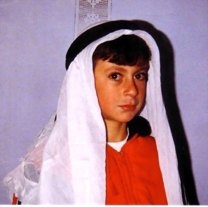 A child wearing traditional clothes