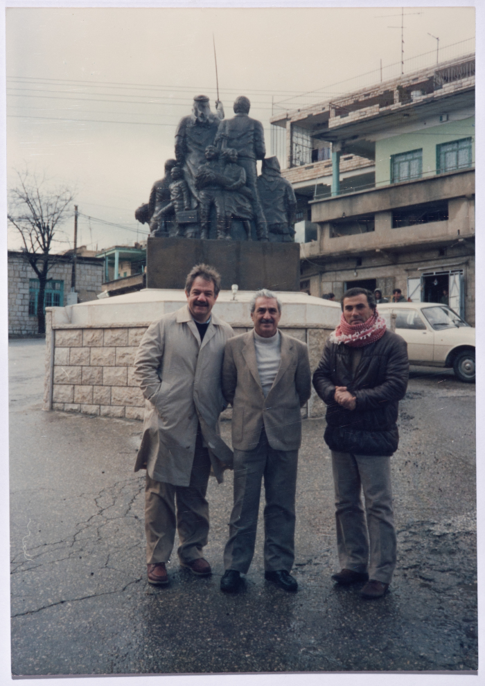 Tawfiq Ziad in front of the statue of the march in the town of Majdal Shams