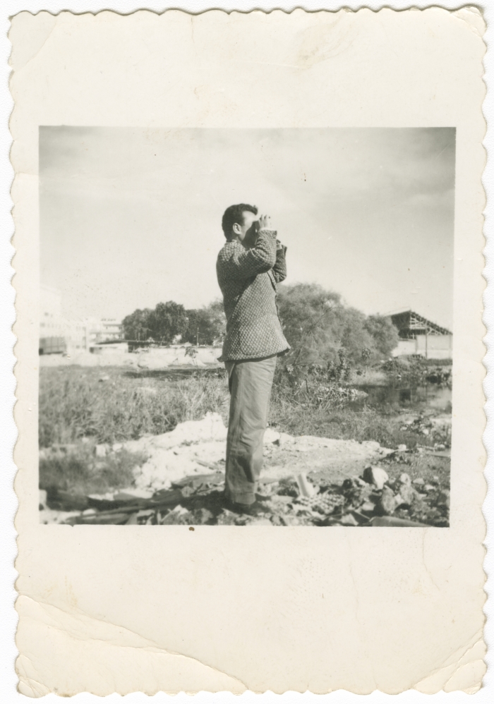 A man using a binocular