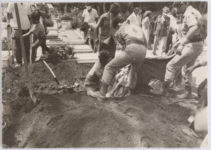 Medics Burying Corpses 