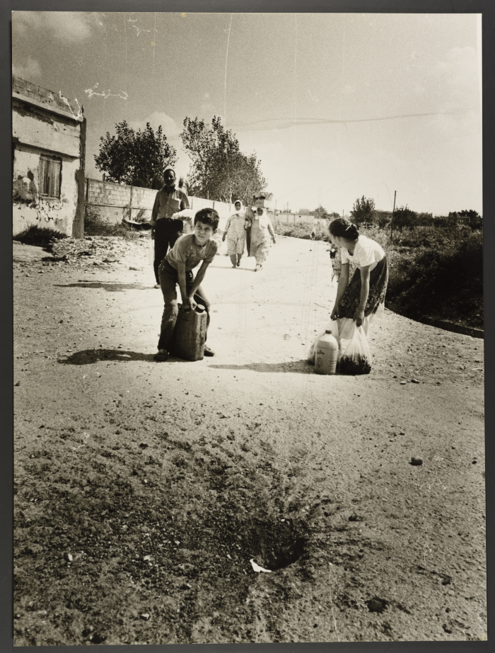 Children Carrying Houseware During the Bombardment of Rashidieh Camp 