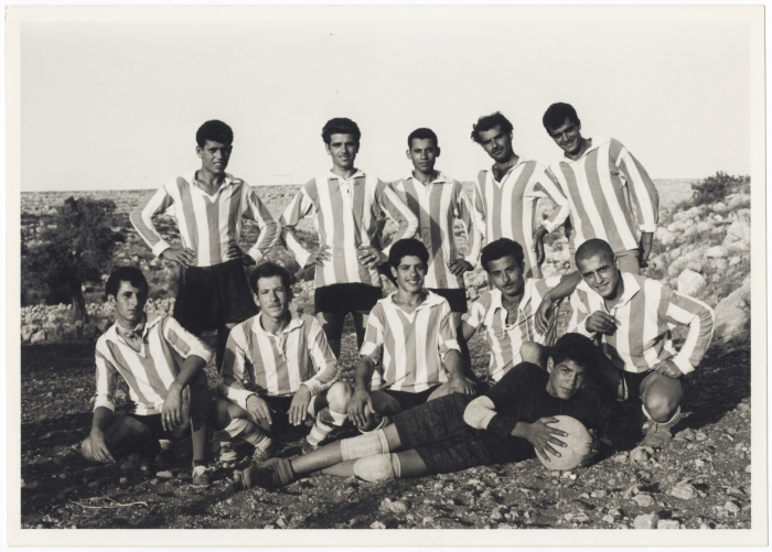 A group of people playing soccer in the Tamra team