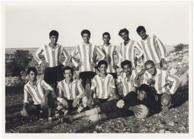 A group of people playing soccer in the Tamra team